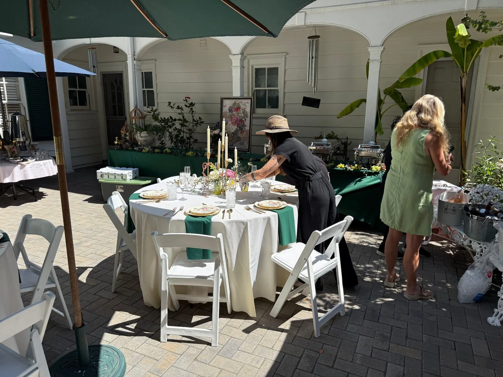 Courtyard tables and chairs staged for an evening reception at a Yountville venue catered by Napa Catering Company