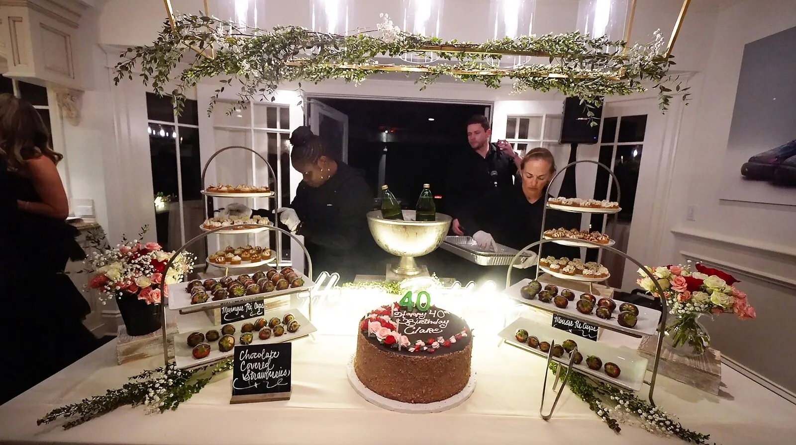 Dessert display of mini pastries, cookies and chocolate-dipped strawberries at a Napa reception by Napa Catering Company